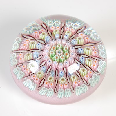 Lot 464 - A pink ground millefiori glass paperweight,...