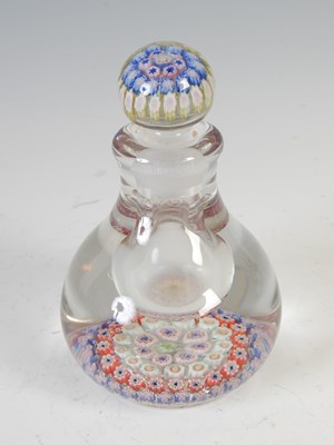 Lot 464 - A pink ground millefiori glass paperweight,...