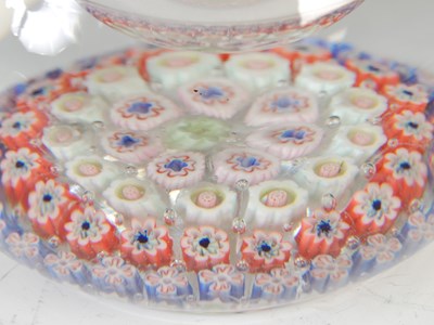 Lot 464 - A pink ground millefiori glass paperweight,...