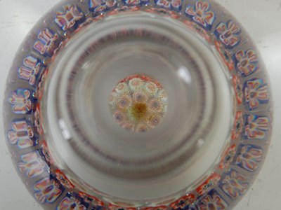 Lot 464 - A pink ground millefiori glass paperweight,...