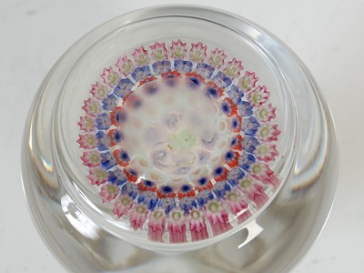 Lot 464 - A pink ground millefiori glass paperweight,...