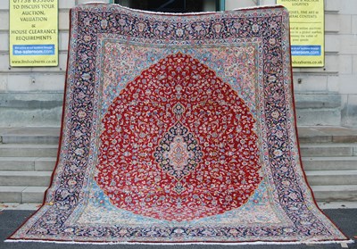 Lot 1055 - A 20th century Persian rug, centred with a...