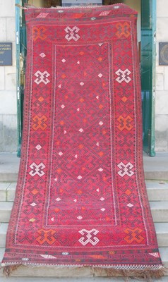 Lot 1060 - A Persian flatweave long rug, early to...