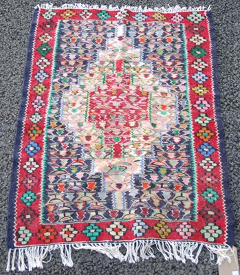 Lot 1069 - A Persian flatweave mat, the rectangular blue...