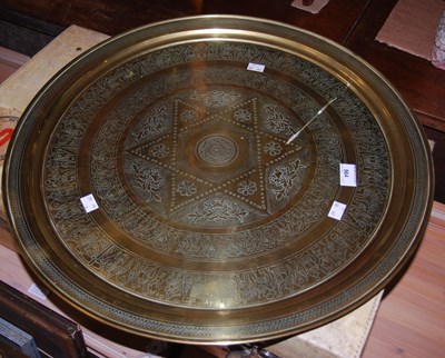 Lot 964 - A large Eastern brass charger centred with a...