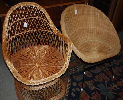 Lot 972 - A shaped wicker elbow chair, together with...