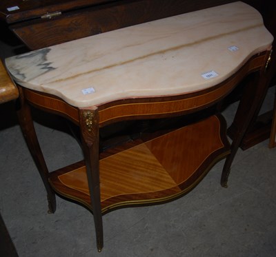 Lot 1031 - A reproduction French style marble topped...