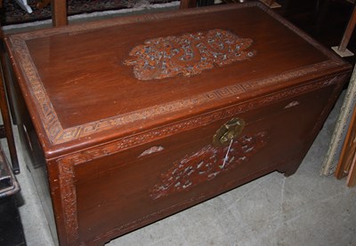 Lot 991 - A Chinese carved camphor wood blanket box.