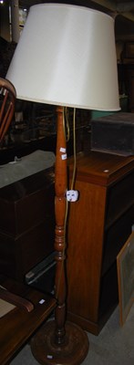 Lot 994 - A mahogany standard lamp and shade.