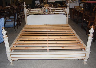 Lot 1039A - A carved, painted and giltwood double bed,...