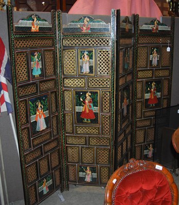 Lot 1046 - A four-fold painted and pierced screen...