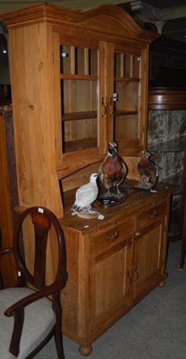 Lot 1005 - A 20th century two-part pine dresser.