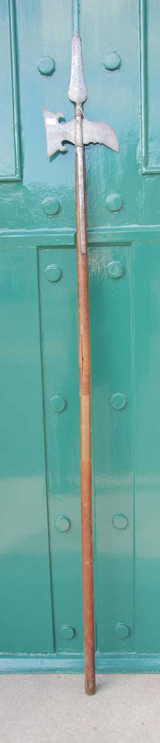 Lot 659 - An antique halberd / pole axe, the axe...