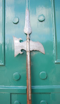 Lot 659 - An antique halberd / pole axe, the axe...