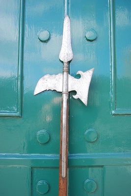 Lot 659 - An antique halberd / pole axe, the axe...