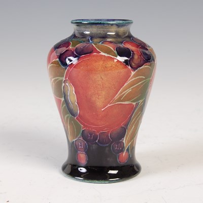 Lot 486 - Pomegranate, a miniature Moorcroft vase,...