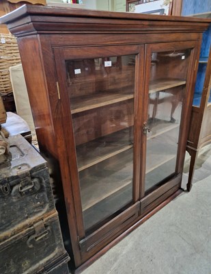 Lot 724 - A 20th century mahogany glazed bookcase with...