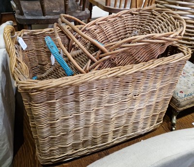 Lot 667 - A wicker twin-handled fire/ laundry basket...