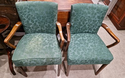 Lot 765 - A pair of 20th century elbow chairs with green...