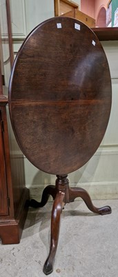 Lot 707 - A 19th century mahogany circular snap-top...