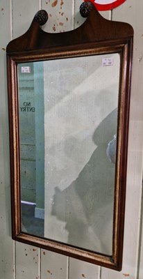 Lot 632 - An antique mahogany wall mirror with broken...