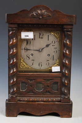 Lot 306 - An antique oak mantle clock, with shaped brass...