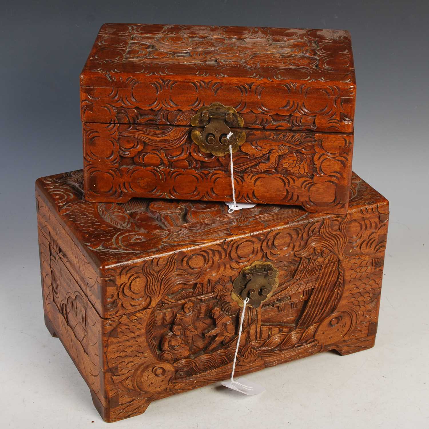 Lot 313 - A Chinese carved camphor wood storage box...