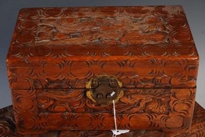 Lot 313 - A Chinese carved camphor wood storage box...