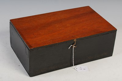 Lot 314 - A mahogany box containing metal chess pieces...