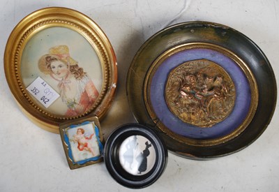 Lot 324 - A box containing a circular portrait...