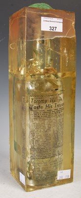 Lot 327 - Whisky interest: one bottle mounted in resin,...