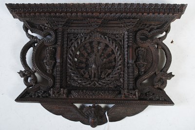 Lot 345 - An Indonesian carved wooden wall plaque...