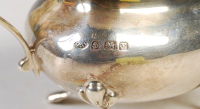 Lot 114 - An early 20th century three-piece silver...
