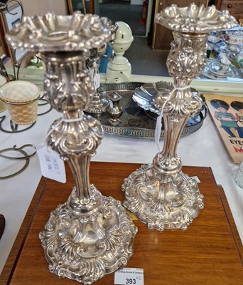 Lot 392 - A pair of ornate EPNS candlesticks.