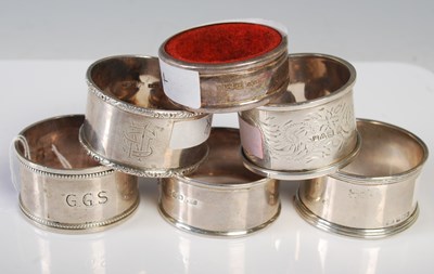Lot 129 - A collection of six assorted silver napkin rings.