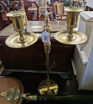 Lot 416 - An antique brass adjustable two-light candle...