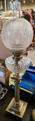 Lot 423 - A 20th century oil lamp with frosted glass...