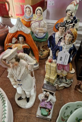 Lot 458 - A collection of Staffordshire figures to...