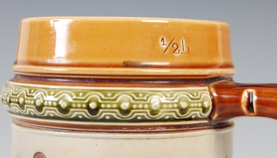 Lot 513 - A Mettlach stoneware beer stein, with incised...