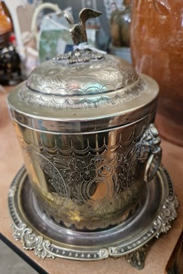 Lot 486 - A silver plated biscuit barrel, the lid with...