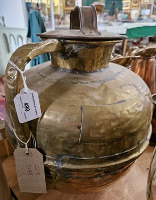 Lot 490 - An antique brass water jug of large...