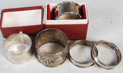 Lot 178 - A collection of five assorted silver napkin...