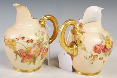 Lot 248 - Two Royal Worcester ivory ground flat-back jugs.