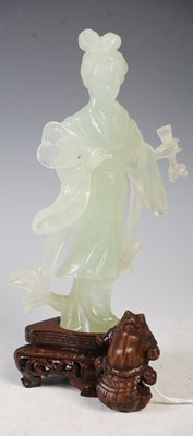 Lot 104 - A boxed Chinese green stone figure of a lady...