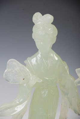 Lot 104 - A boxed Chinese green stone figure of a lady...