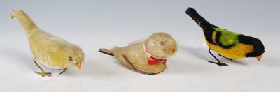 Lot 110 - Two clockwork bird toys and a seal toy.