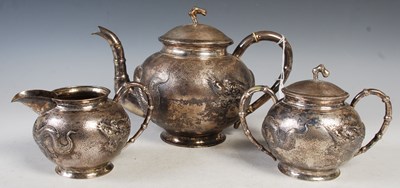 Lot 182 - A Chinese silver three-piece teaset, makers...