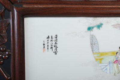 Lot 187 - A Chinese porcelain and dark wood table screen,...