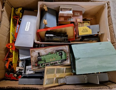 Lot 504 - A box of vintage toys to include two 00 gauge...