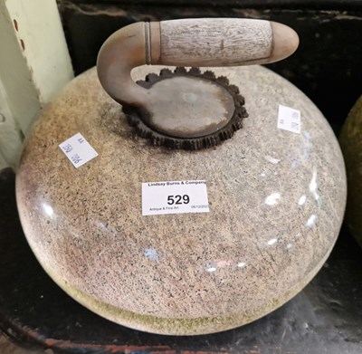 Lot 529 - A granite curling stone.